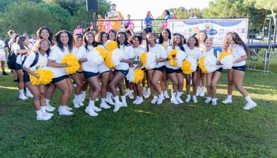 Group of Xavier University Cheerleaders in a field