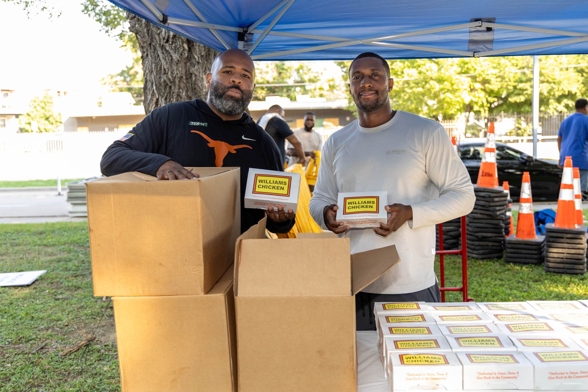 Two men hading out williams chicken