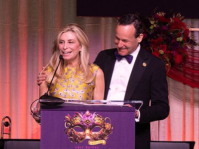 Two people speaking at a podium