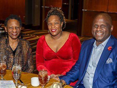 Three masked ball attendees