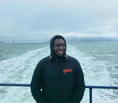Praise Olaiya in front of the bay