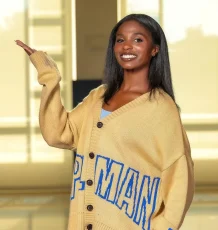 Adria Weaver wears a college letterman sweater. Photo from Spelman College Jaguarettes.
