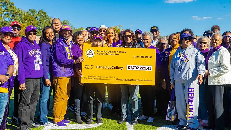 Annual Giving group photo with novelty size check