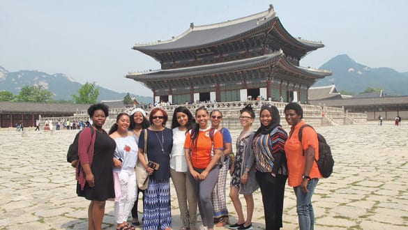 Group shot of Bennett College students in China in front of a temple