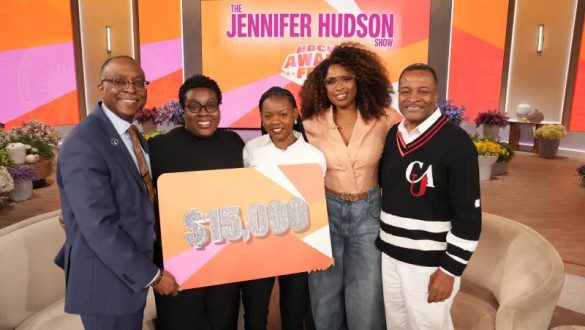 Clark Atlanta Student being presented a card with $15,000 written on it