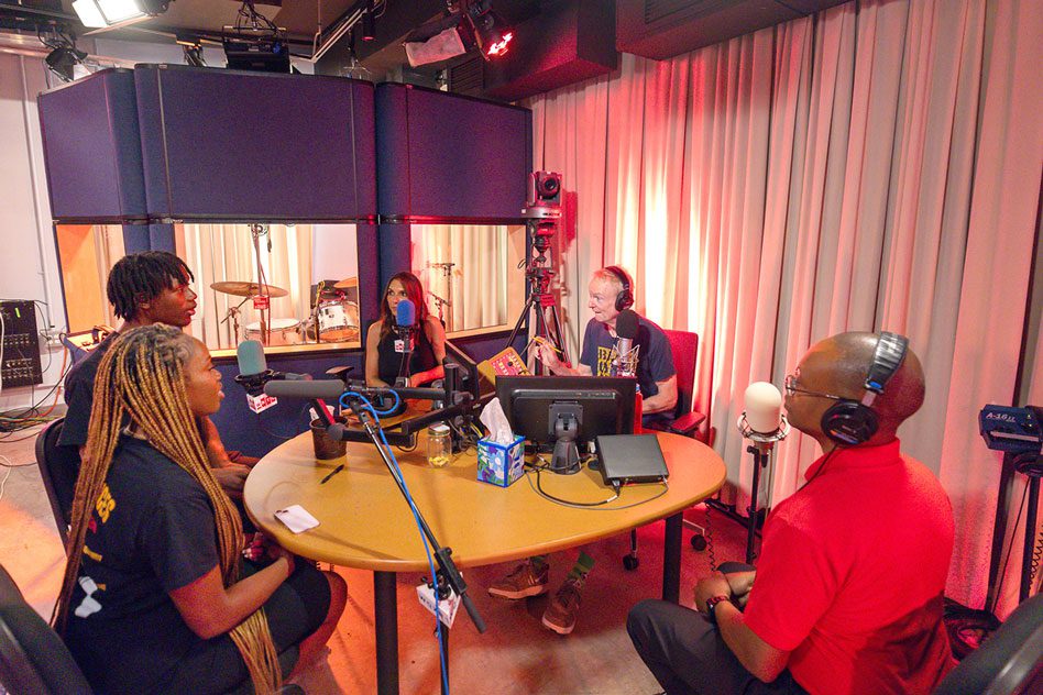 A group in a recording studio