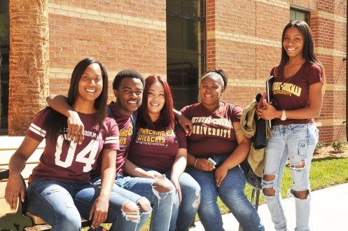 Bethune Cookman University students sitting on campus