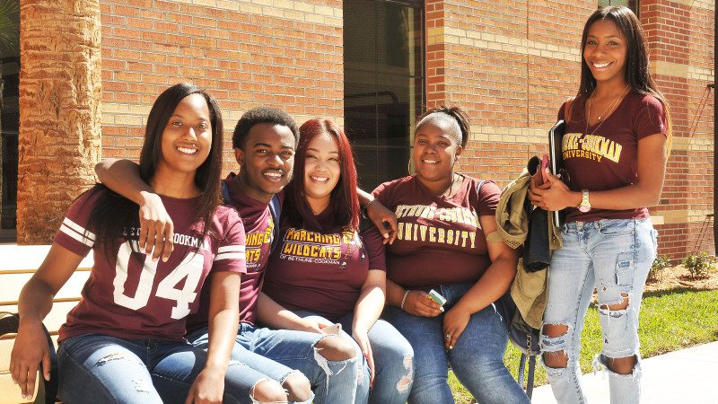 Bethune Cookman University students sitting on campus