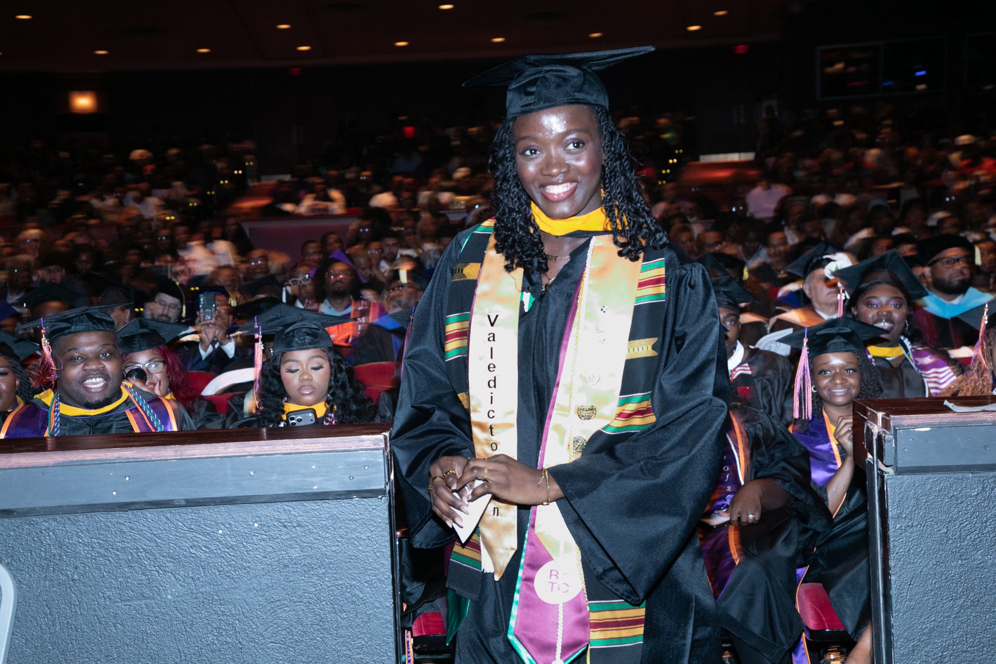 A female graduate in cap and gown
