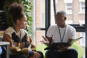 student talking to adult
