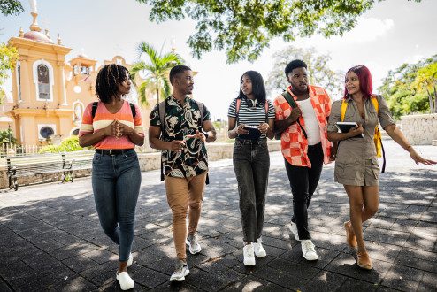 Getty image, college students walking and talking outside