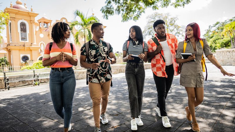 Getty image, college students walking and talking outside