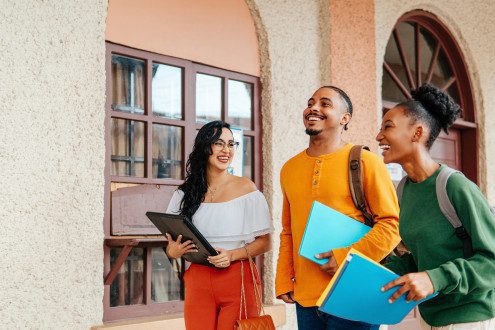 Getty image of students walking with books