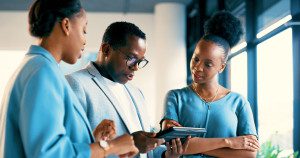 professionals talking in office setting
