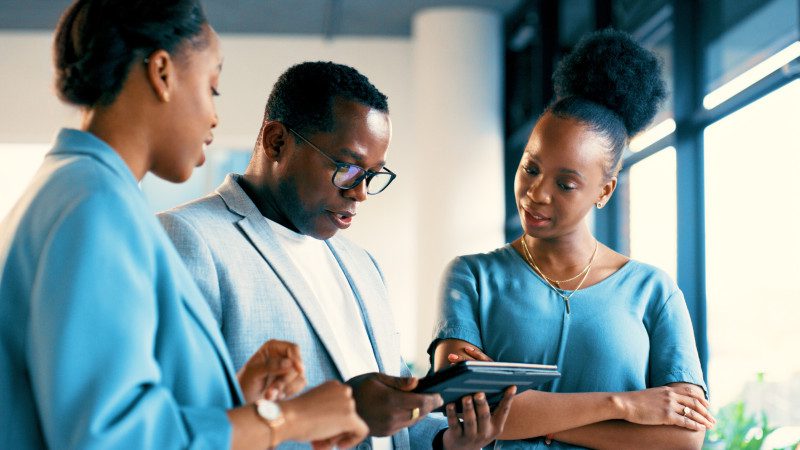 professionals talking in office setting