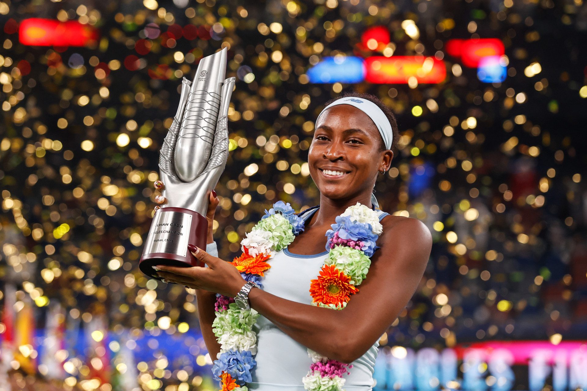 WUHAN, CHINA - OCTOBER 12: Coco Gauff of United States with the winners trophy after winning against Jessica Pegula of the United States during the Women's Singles Final match award ceremony on Day 9 of the Wuhan Open at Optics Valley International Tennis Center on October 12, 2025 in Wuhan, China. (Photo by Wanghe/Getty Images)