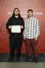 Chris Arocha holds up his dean’s list certificate, which he received for the second consecutive year. Photo from Chris Arocha.