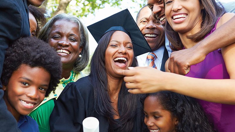 Photo of a girl celebrating graduation with her family