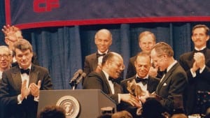 President Bush receives an award from UNCF president Chris Edley, Sr.