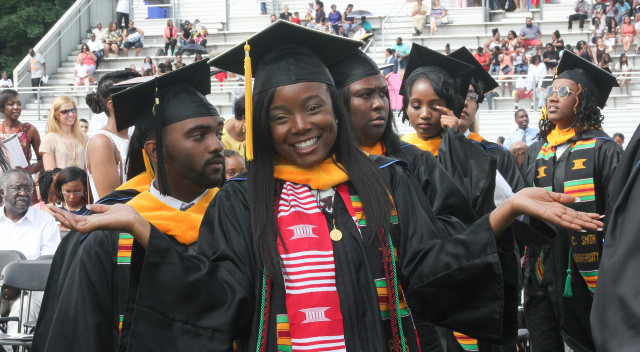 Johnson C Smith Graduate poses for camera at coronation