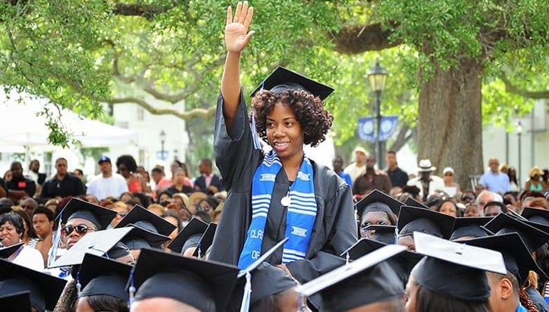 Woman Waving at Graduation