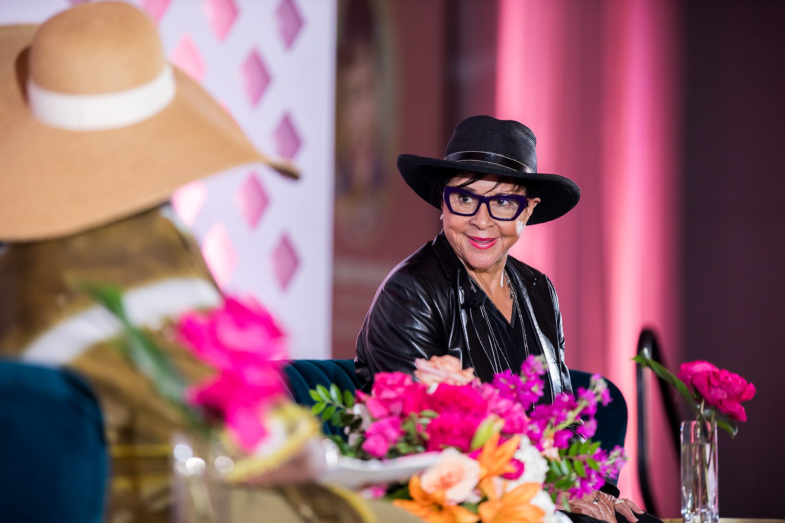 woman seated onstage
