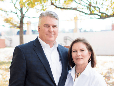 headshot of Mayor Henderson and his wife