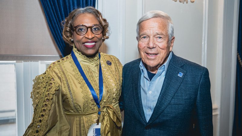 Robert Kraft posing with a lady