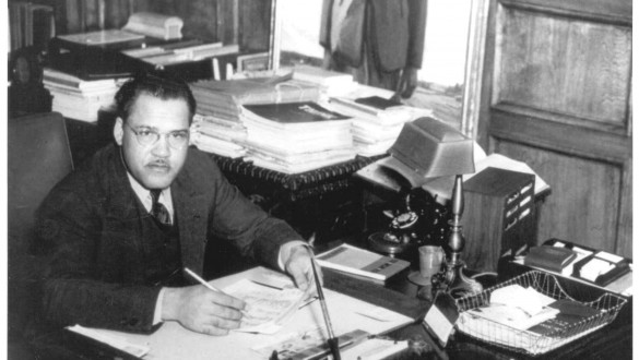 Frederick D. Patterson sitting at desk