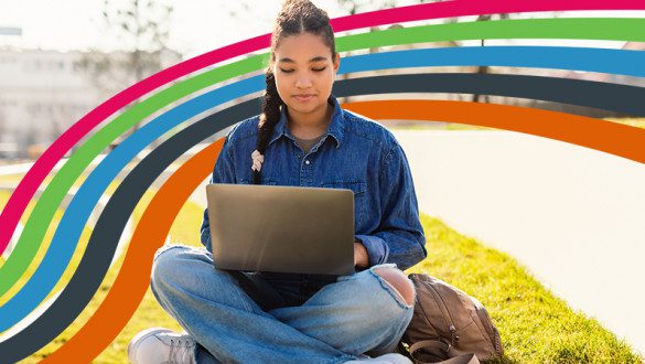 A student on a laptop with fidelity colors in the background