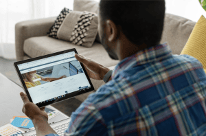 Man using LinkedIn on a tablet