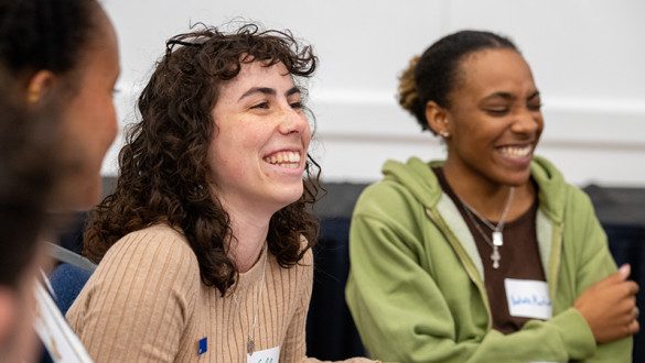 Students laughing at Unity Dinner event