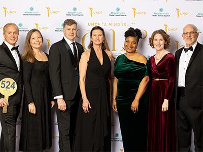 Group of people in front of Step n Repeat