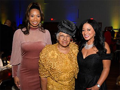 Three female event attendees