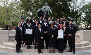 Tuskegee architecture students in front of statue
