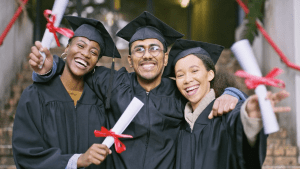 Graduates-smiling-with-diplomas