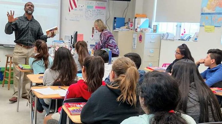 Dr. William Hobbs teaching elementary school children in a classroom