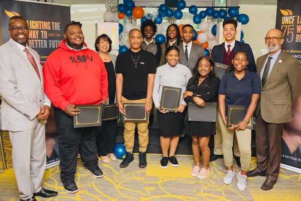 UNCF President Dr. Michael Lomax, Senior Vice President Scholarships and Professional Development Programs Larry Griffith and UNCF scholarship recipients