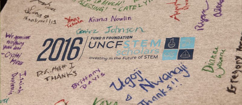 Stem scholars shirt with event participants signatures on it