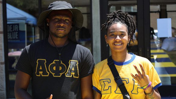 Two students in fraternity/sorority attire