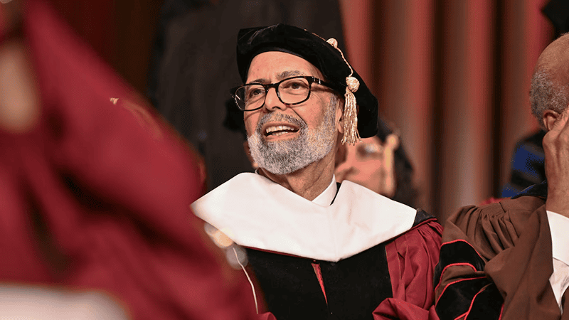 Dr. Lomax in graduation attire