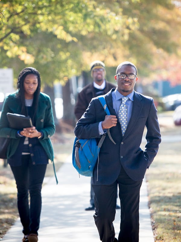 3 students walking outside at Philander Smith University