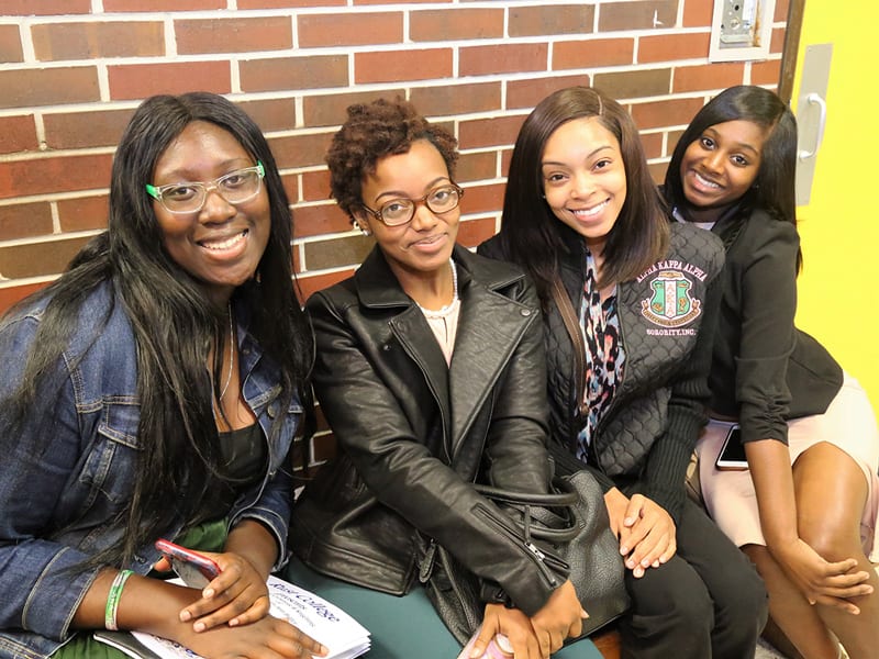 Group shot of 4 female Rust College students smiling