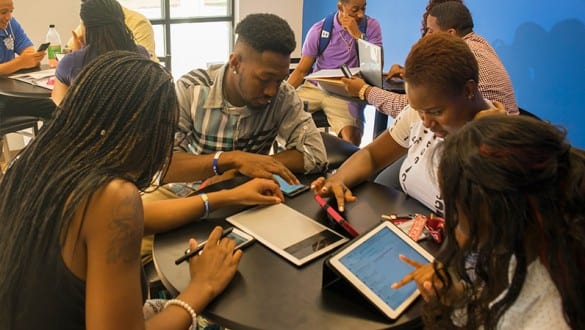 Group shot of Voorhees College students studying using tablets