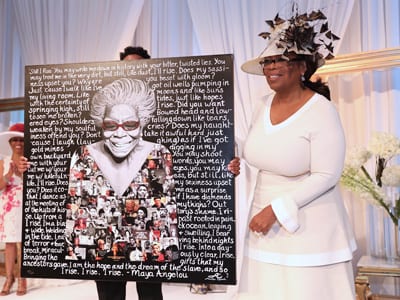 Winfrey with commemorative plaque of Dr. Maya Angelou