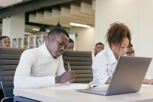 students working on laptop