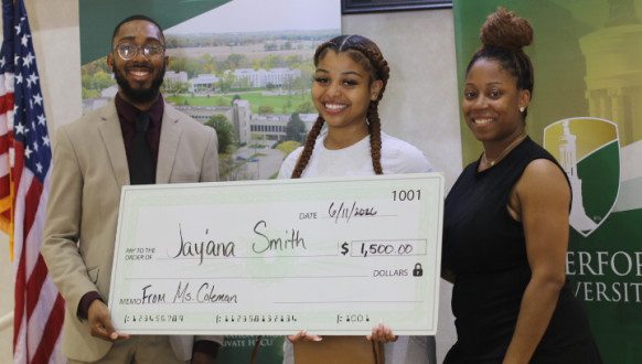 Jayana Smith receives a $1,500 novelty size check