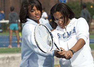 spelman tennis instructor and student