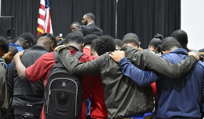 Texas College students praying at event