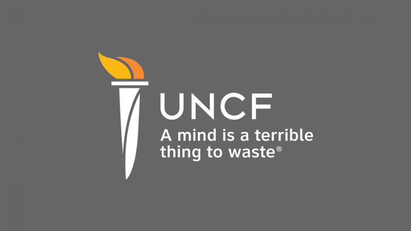UNCF logo with torch on gray